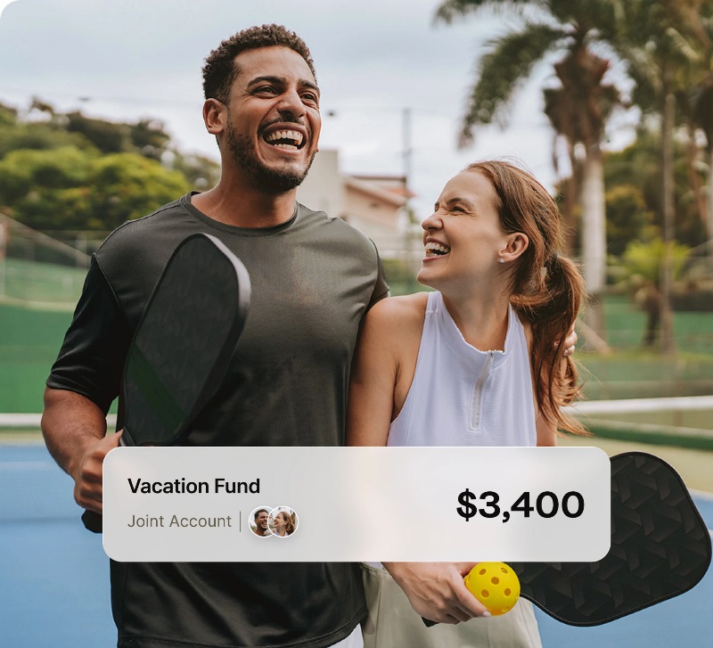 Couple playing pickleball with an EQ Bank joint account saving up for their next vacation